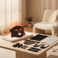 Black flexible LED light therapy mask with neck attachment, controller, straps and pouch
