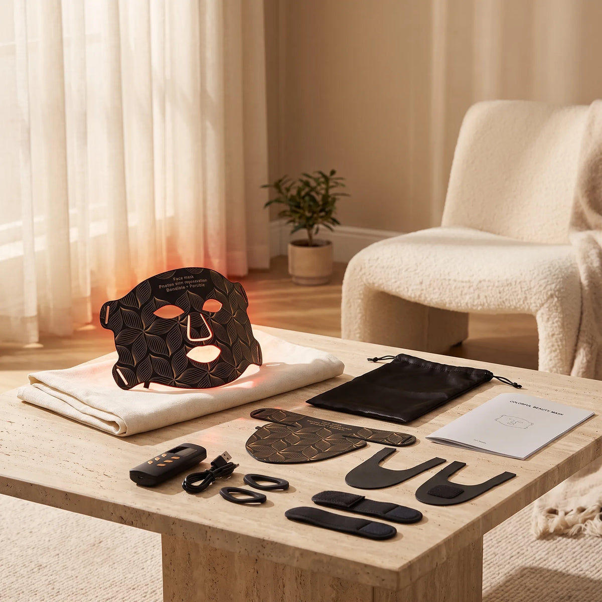 Black flexible LED light therapy mask with neck attachment, controller, straps and pouch